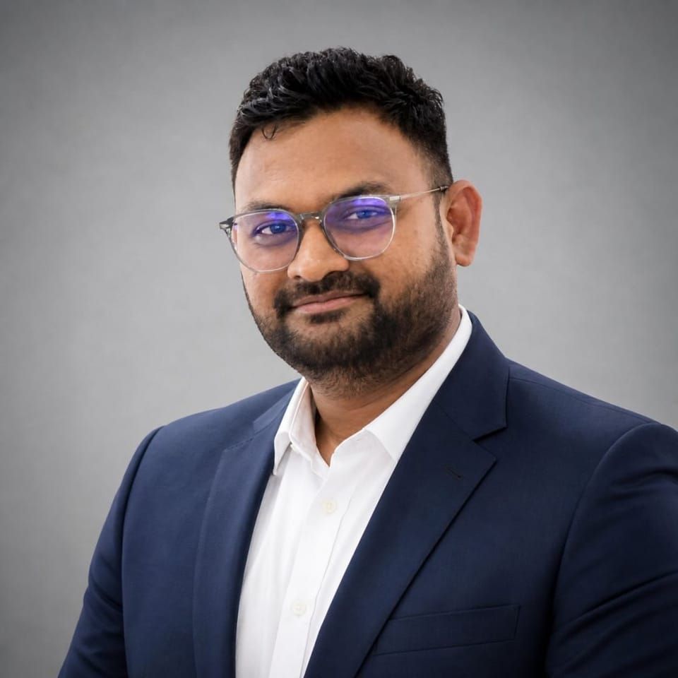 Pratik Dudhat, founder of Jakado, in a navy suit